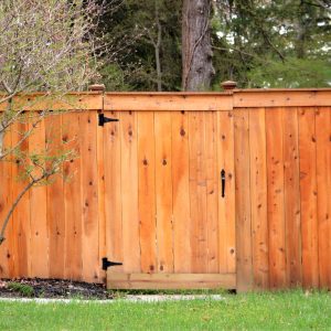 Wooden stained fence made out of lumber